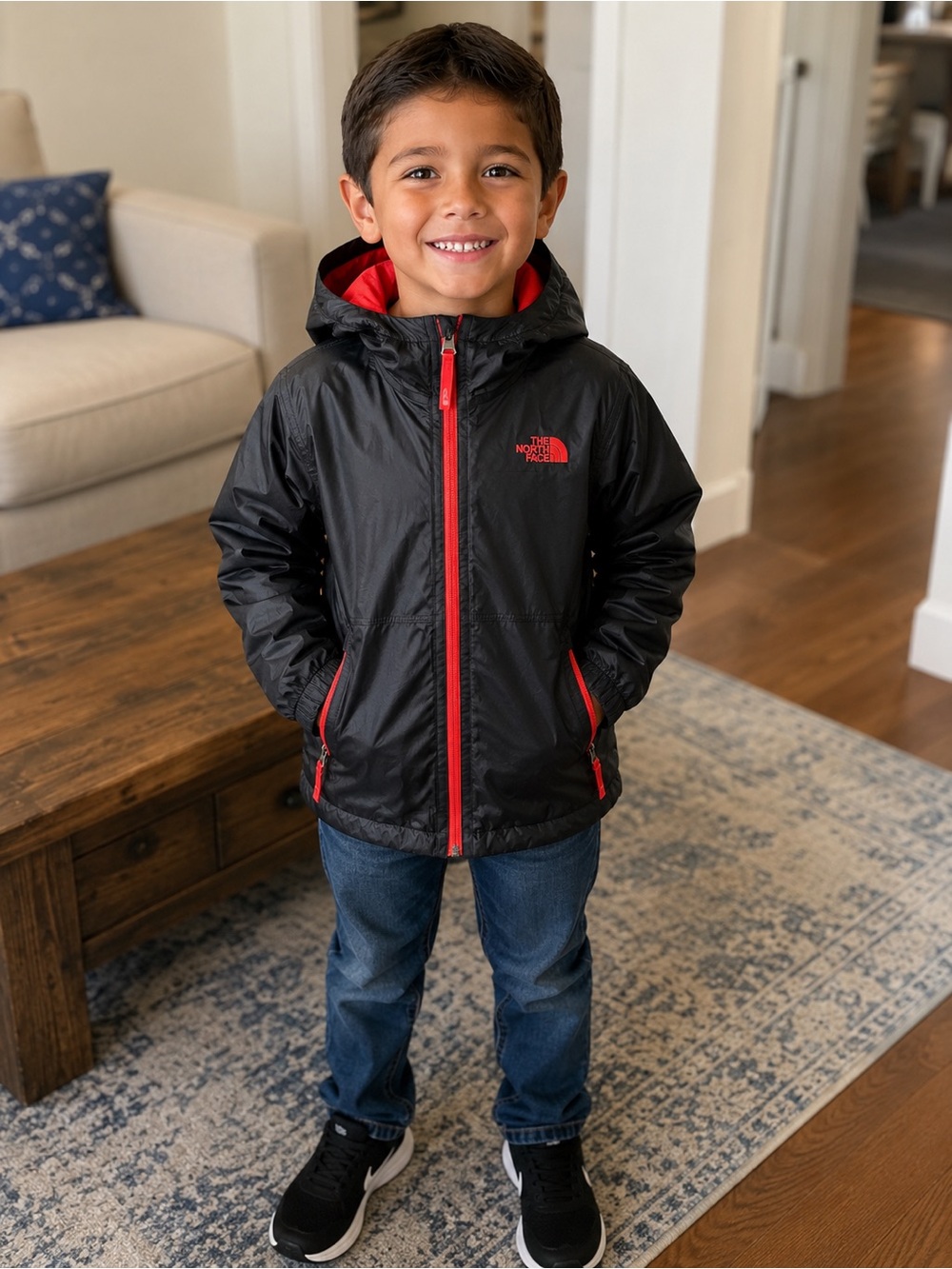 The North Face Black Jacket with Red Trim for Kids